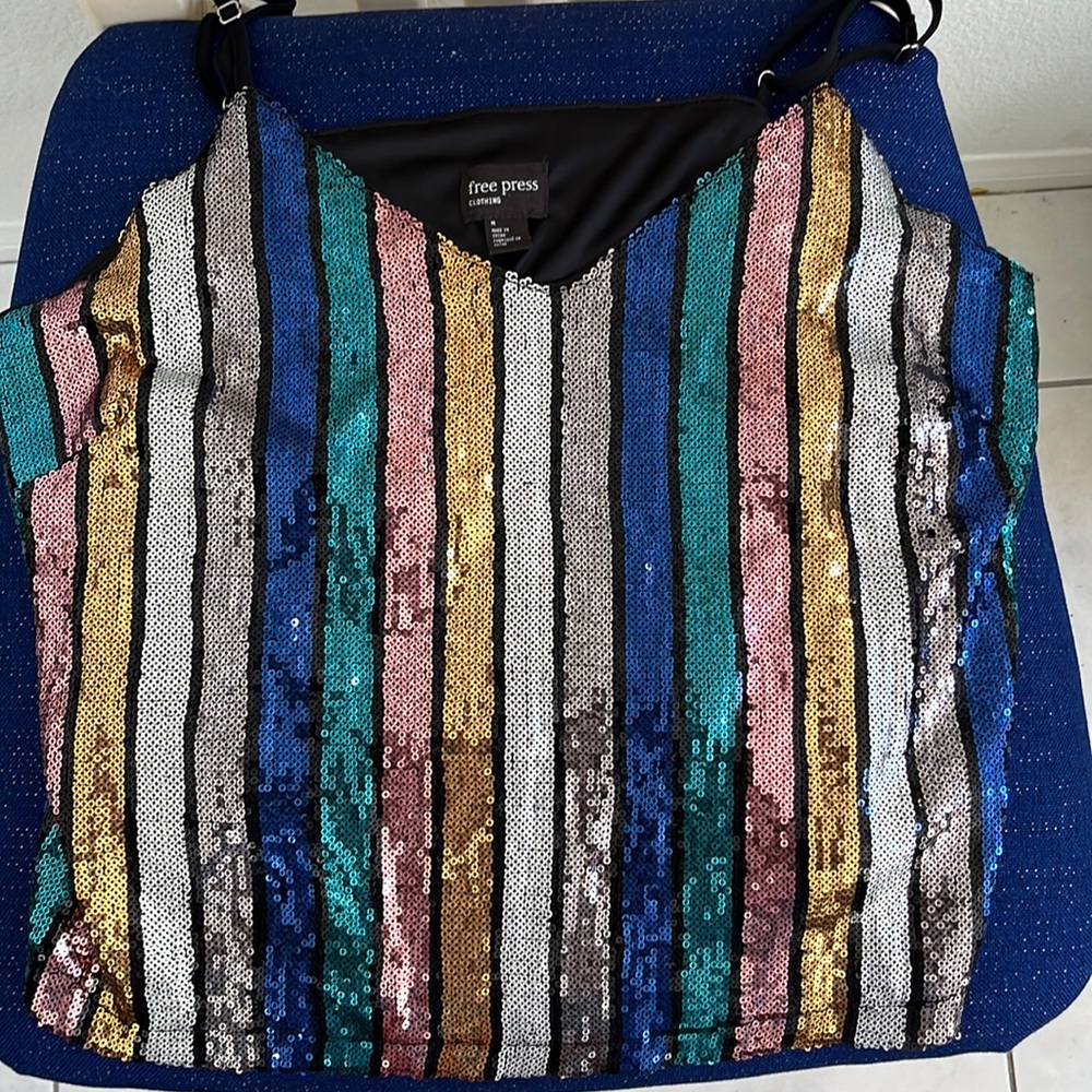 A medium colorful sequence top from Free Press. Only wore it twice.
